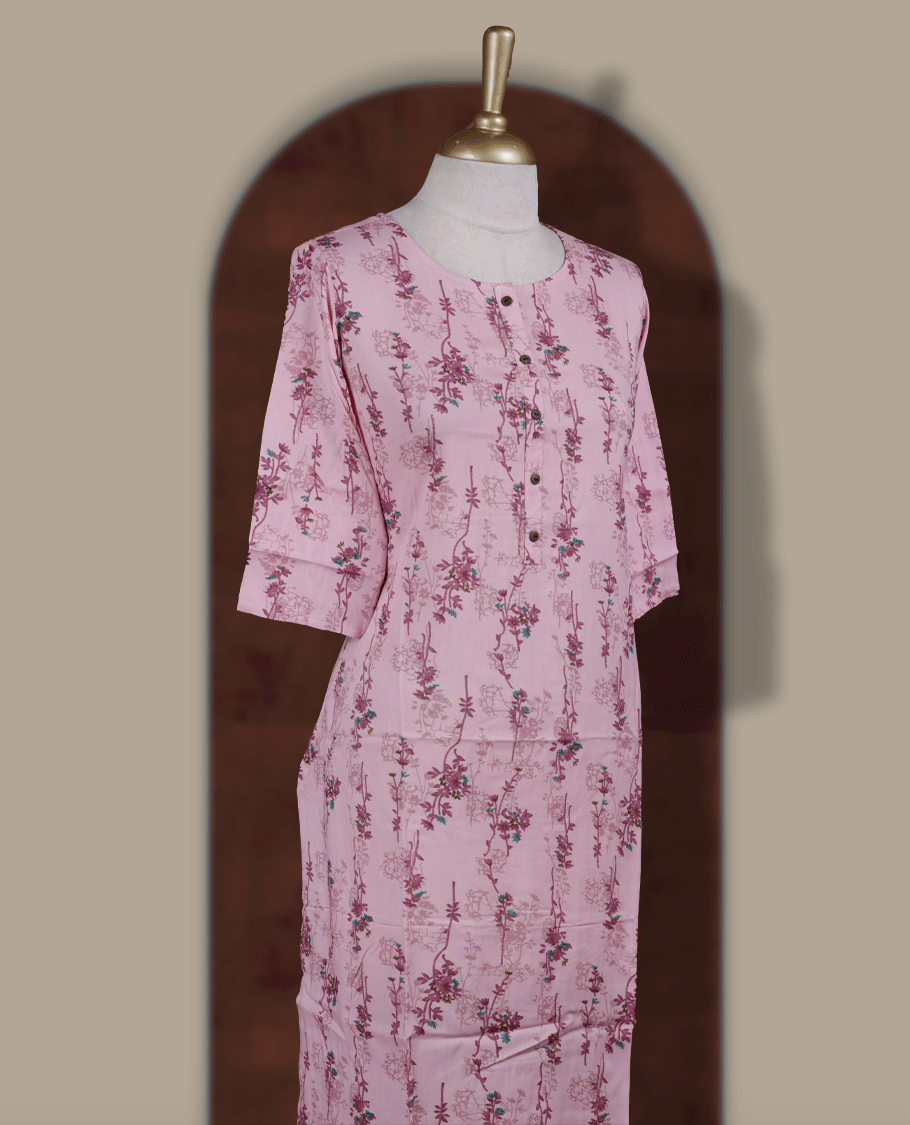 Baby pink colour kurti from TWARA, featuring with delicate floral prints and front button detailing & Designed with a round neckline and three quarter sleeves.