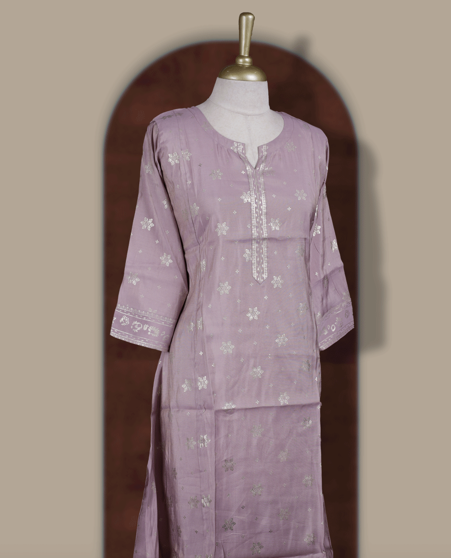 Soft Lavender colour Kurti adorned with all over Gold colour floral Block prints, featuring a straight cut kurta with round neckline and 3/4th sleeves.