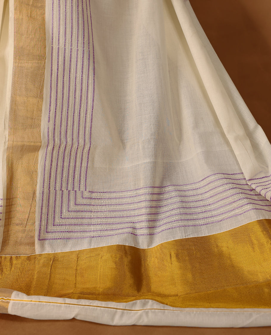 Elegant off white colour cotton Kerala saree featuring lavender colour Thread detailing on body, gold zari traditional kasavu border, Paired with matching blouse offering a classic and graceful look