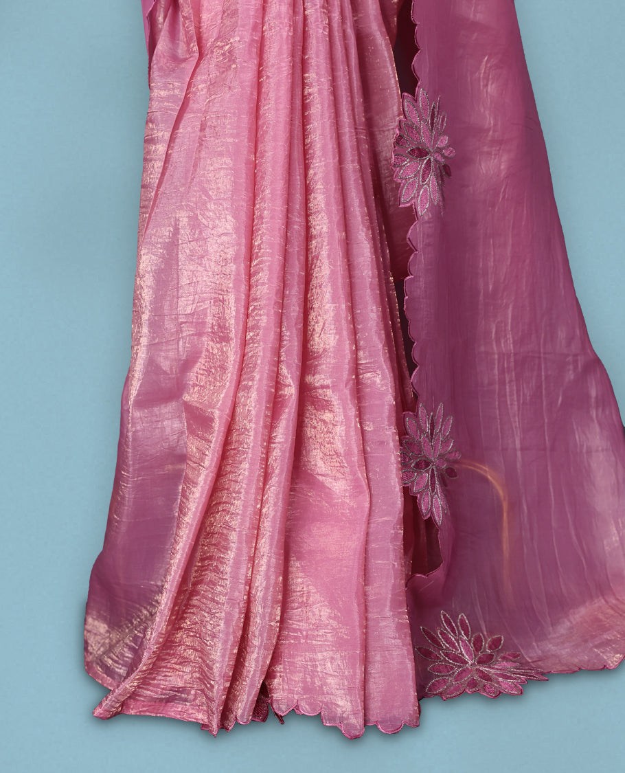 Pink colour crush soft silk saree adorned with bold floral thread embroidery on the body and scallop edged borders, Paired with a matching blouse for a complete look.