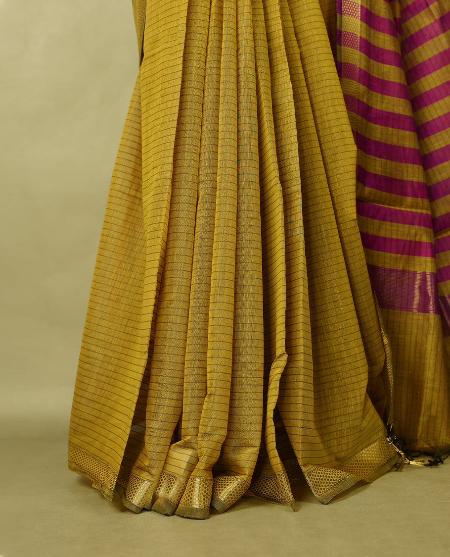 Mustard colour chanderi cotton saree with fine striped body, mangalgiri border, grand pallu featuring magenta and gold zari stripes, with matching blouse.