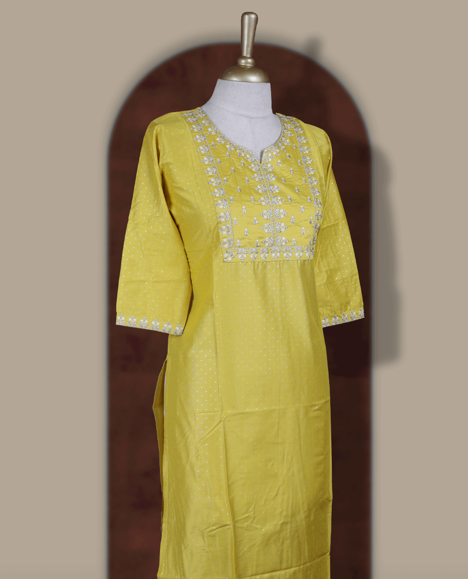 Bright yellow kurthi from TWARA , adorned with delicate white embroidery, featuring a stylish V-notch neckline and comfy 3/4th sleeves.