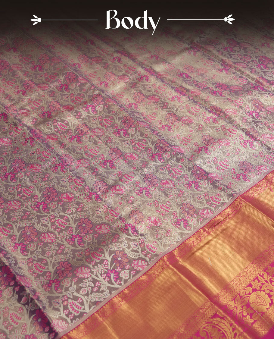 Pastel lavender colour and Antique silver Zari Tissue Brocade Saree features intricate coloured floral Motifs on body and bright pink colour border & pallu with traditional patterns, paired with matching blouse