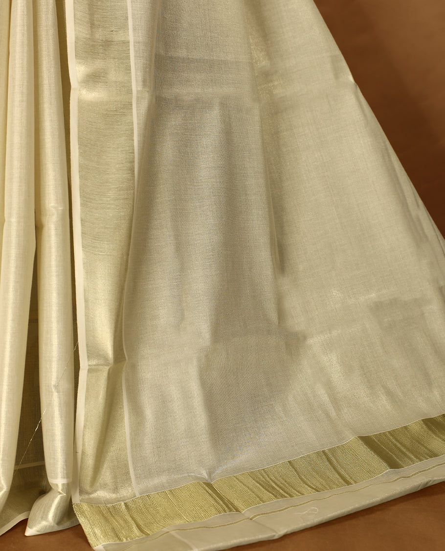 Light Gold colour Tissue Kerala saree featuring Plain body and a beautifully woven light Gold Kasavu border, paired with a matching blouse perfect for festive occasions.