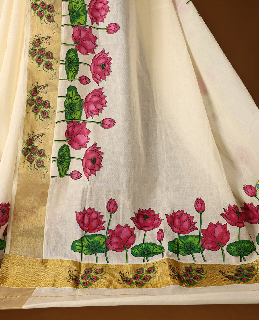 Elegant off white Kerala cotton saree with vibrant pink lotus digital prints and a rich golden zari border. Perfect blend of tradition and charm, paired with a matching blouse piece for a complete look.