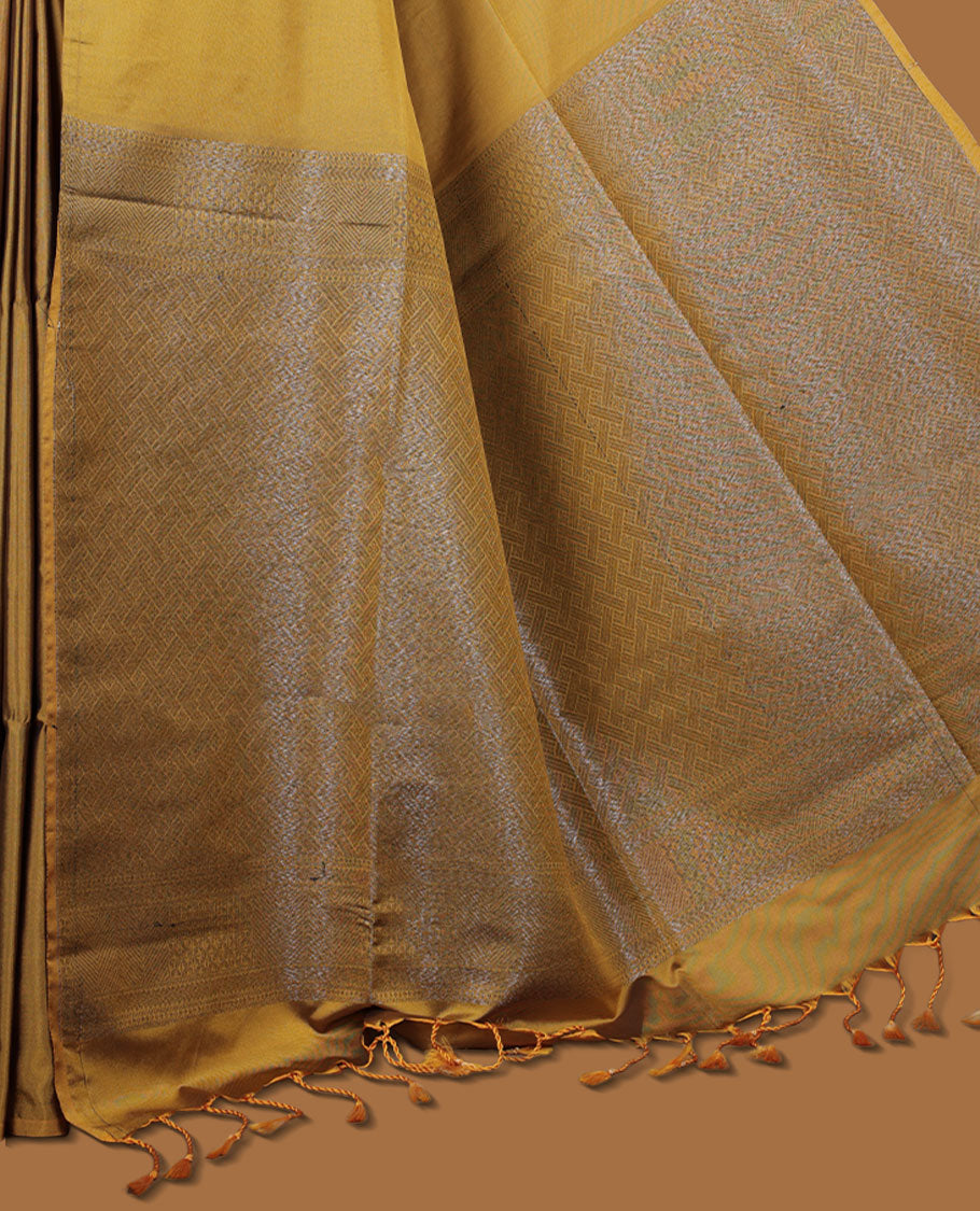 Olive yellow colour semi soft silk saree adorned with delicate woven floral in square motifs on the body, complemented by a Self colour woven pallu with intricate detailing and tassel accents without border & Comes with a matching blouse piece.