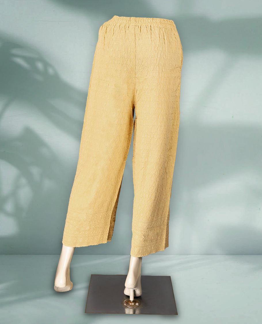 Beige colour palazzo pants featuring intricate self embroidery and a relaxed, flowy fit