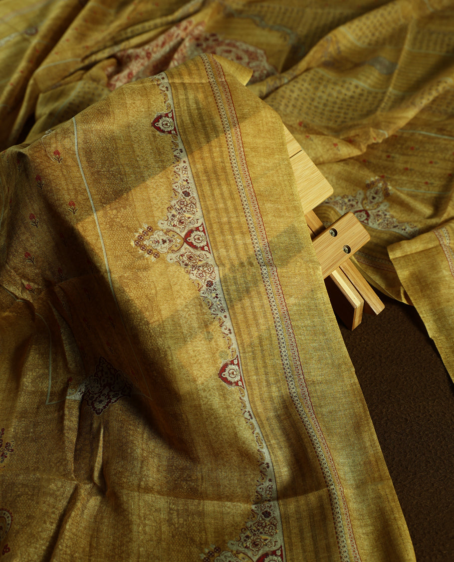 Mustard colour churidhar material with elegant maroon embroidery and delicate motifs, complemented by a plain matching bottom and dupatta.