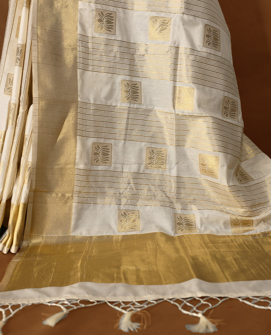 Elegant white colour soft Tussar Kerala saree featuring Stripes and Lotus detailing on body, Gold kasavu border, Rich Pallu, offering a classic and graceful look, paired with a matching blouse.