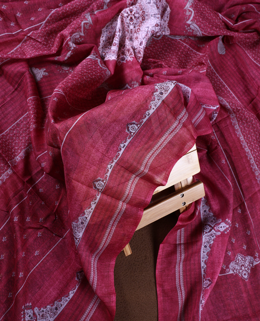 Light maroon colour churidhar material featuring delicate printed patterns with stone highlights, paired with a plain matching bottom and coordinating dupatta.