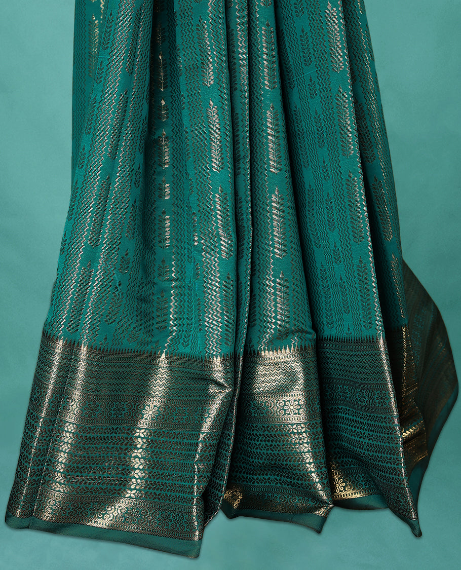 Teal Green Art Soft Silk Saree showcases intricate silver zari work on the body and border, paired with a matching blouse