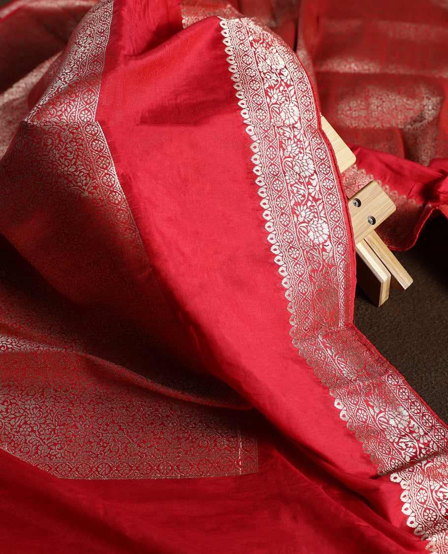 Maroon colour churidhar material with elegant golden zari floral weaves and stone embellishments, paired with a plain matching bottom and dupatta.