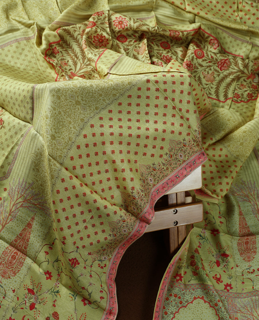 Olive green colour churidhar material adorned with subtle red prints and intricate embroidery on the neckline, paired with a beautifully printed dupatta and plain matching bottom.