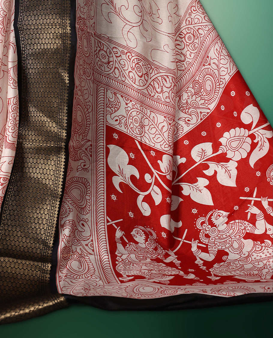 off white colour saree adorned with intricate red Kalamkari style motifs, complemented by a bold red pallu featuring traditional designs, and finished with a rich black woven border, paired with a matching blouse