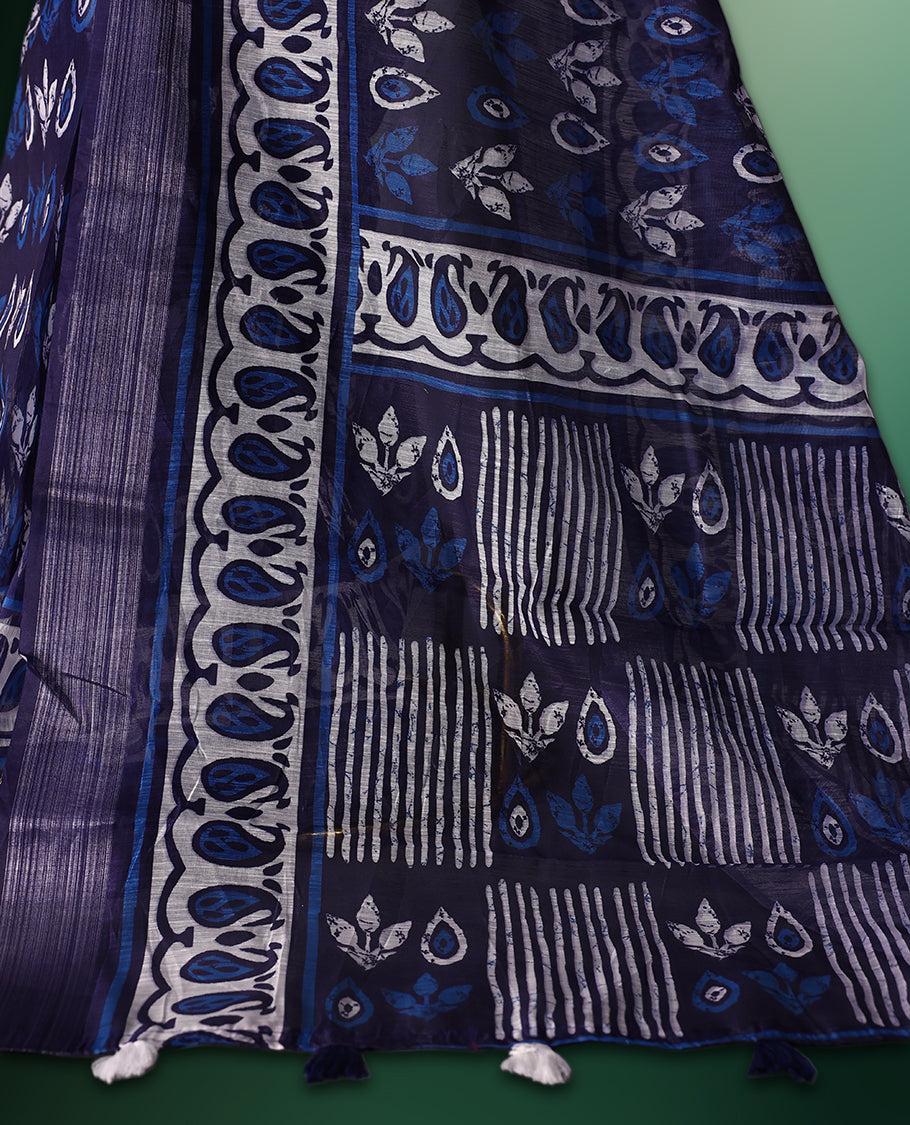 Navy Blue colour cotton saree featuring traditional white and blue hand block prints across the body, highlighted with artistic motifs and a contrasting patterned border, paired with a matching blouse.