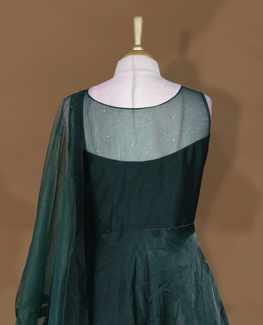 Emerald green colour Gown with stitched sleeveless blouse featuring embellished neckline and waist detailing, paired with a matching stitched flared lehenga and sheer dupatta.
