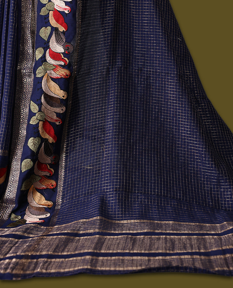 Navy Blue viscose saree featuring subtle checkered patterns and a beautifully embroidered bird motif border, paired with a rich pallu & perfect for festive occasions, celebrations, and elegant gatherings.