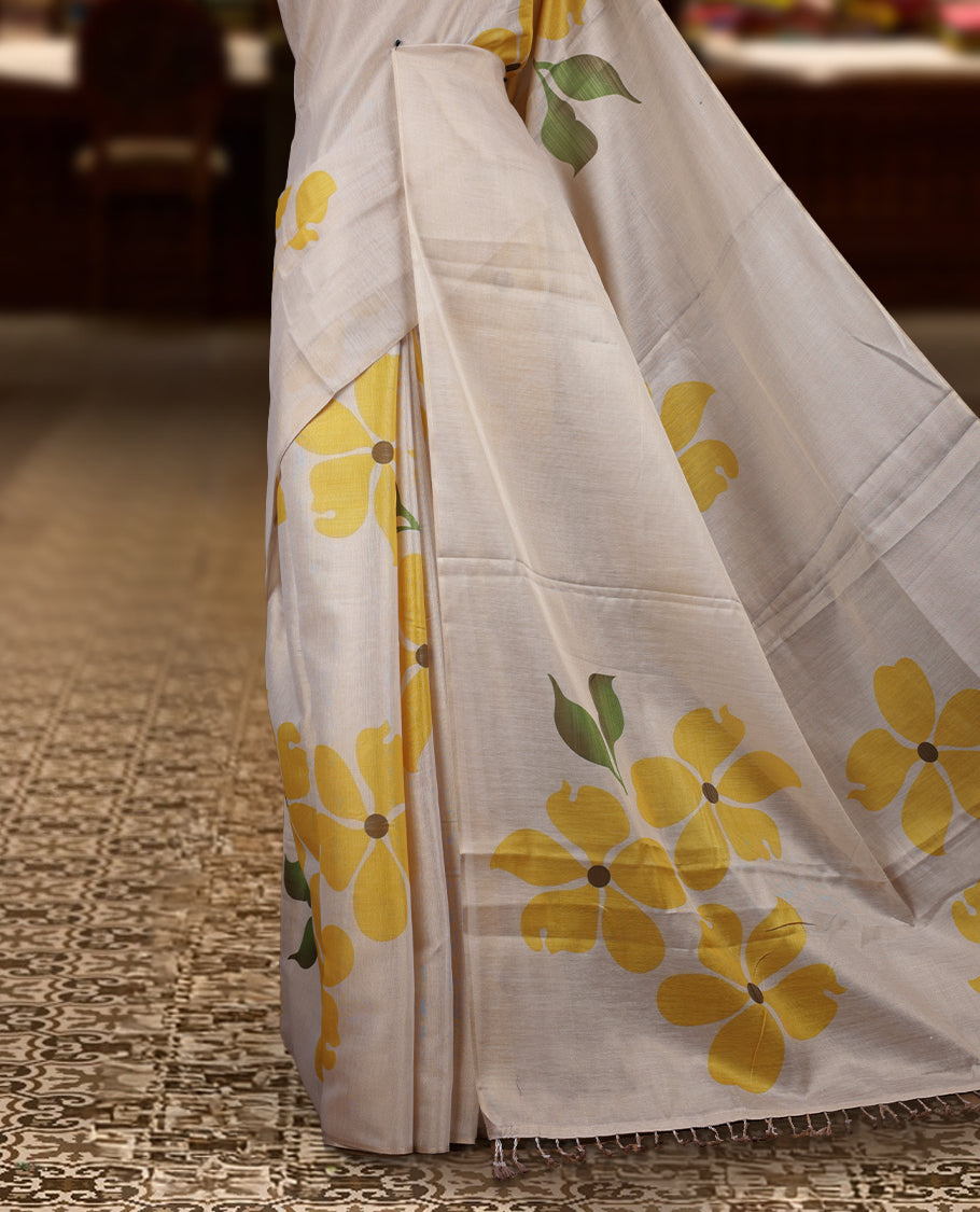 Beige colour Semi tissue saree adorned with Yellow colour digital Bold Floral Design on the body and an elegant pallu & comes with a matching blouse piece