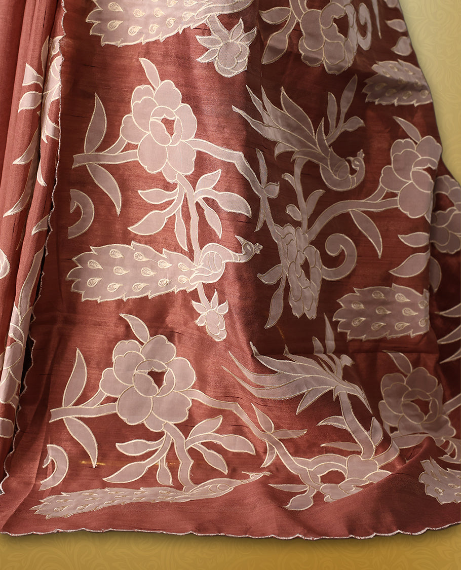 Mauve colour semi tussar saree adorned with elegant white applique work in leaf and floral designs across the body and border, paired with a matching blouse.