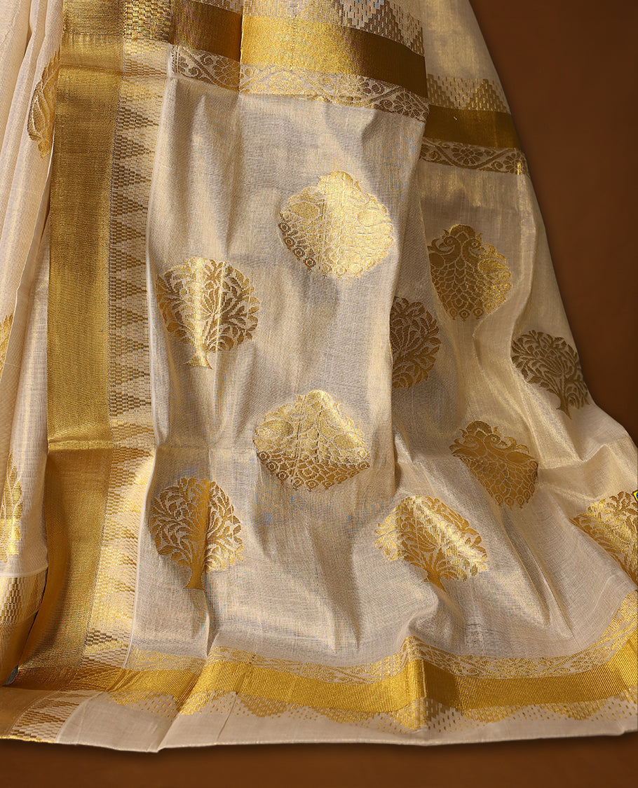Elegant Kerala Kasavu saree in ivory with golden zari work. Perfect for festivals, weddings, and traditional events, Pair with a contrast blouse and gold jewelry for a timeless, graceful look.