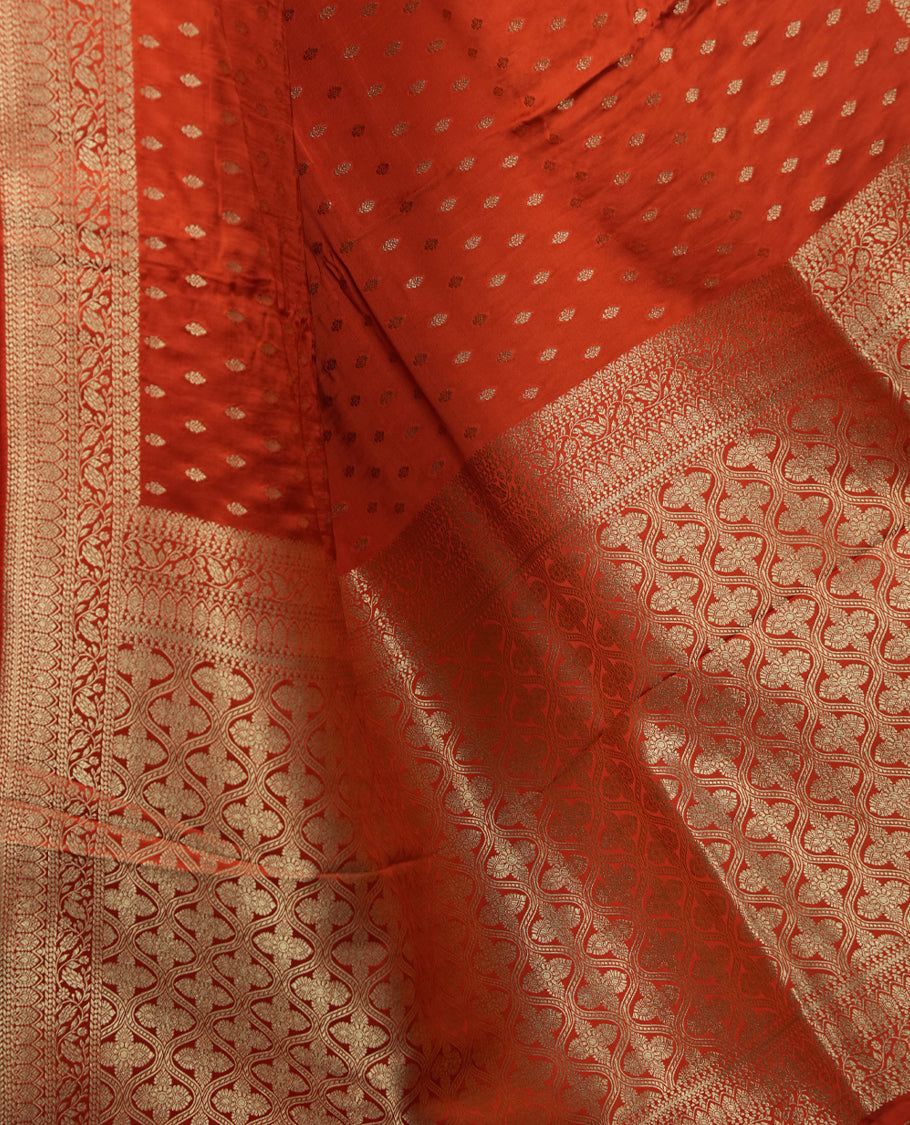 Orange Colour Semi Banarasi Satin Crepe Saree with Silver Zari Buti Motifs, Traditional Gold Ornate Pallu, Elaborate Woven Border, Decorative Tassels with Matching Blouse