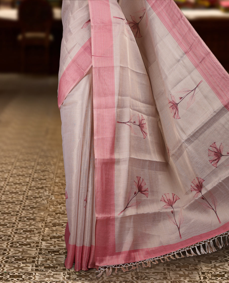 Beige colour Semi tissue saree adorned with Pink toned digital Floral prints on the body and an elegant pallu & comes with a matching blouse piece
