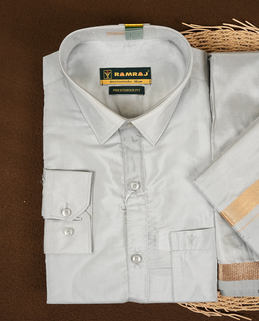 RAMRAJ Silver Grey Colour kurtha paired with a Silver Grey dhoti and a Silver Grey towel, elegantly finished with a matching Gold border.