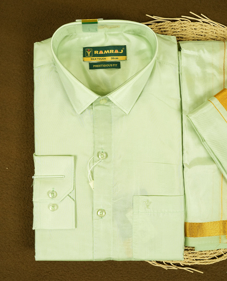 RAMRAJ Light Green Colour kurtha paired with a Light Green dhoti and a Light Green towel, elegantly finished with a matching Gold border.