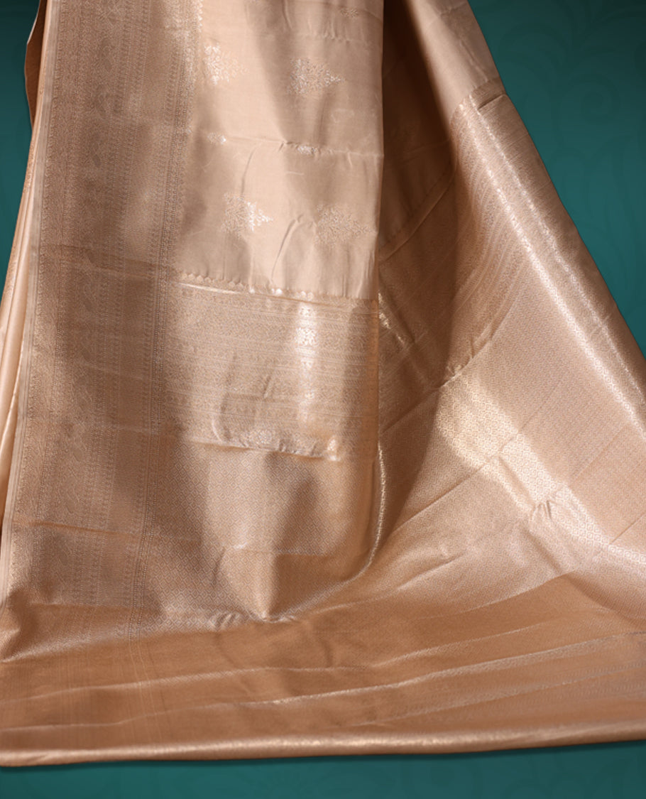 Beige colour semi silk saree featuring a plain lustrous body, complemented by a rich self colour woven border and pallu, paired with a matching blouse.