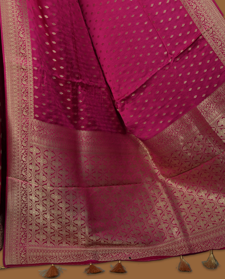 Magenta Colour Semi Banarasi Satin Crepe Saree with Gold Zari Buti Motifs, Traditional Gold Floral Pallu, Elaborate Woven Border, Decorative Tassels with Matching Blouse