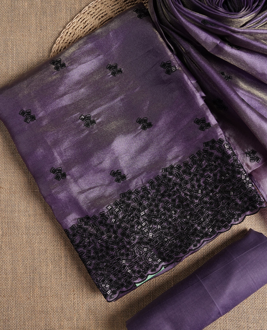 Soft purple colour dual shaded suit material featuring intricate black thread and sequin embroidery with a delicate lace border, Paired with a matching embroidered dupatta and plain bottom.