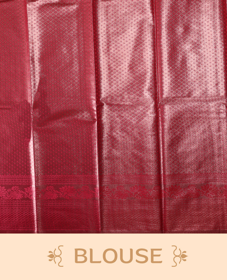 Maroon colour semi silk brocade saree featuring intricate self design brocade patterns across the body, complemented by a rich self colour woven border and pallu, paired with a matching blouse.