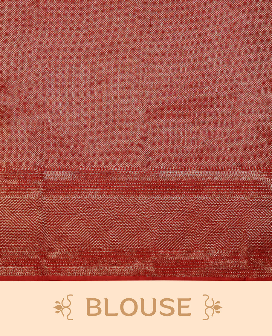 Red Colour Manthrakodi saree featuring a golden zari brocade body, complemented by a self coloured zigzag brocade border and a matching blouse.