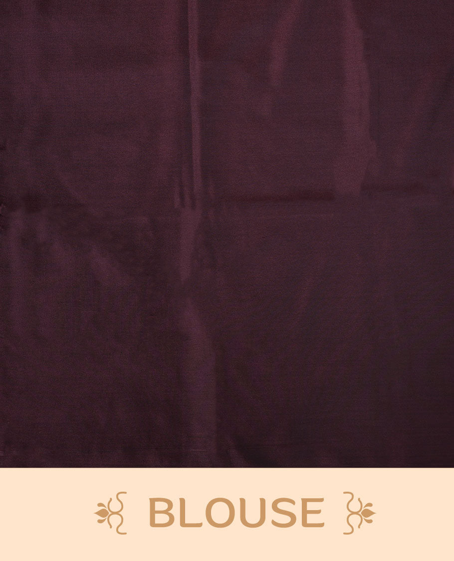 Reddish gray colour semi soft silk saree adorned with delicate woven floral motifs on the body, complemented by a contrast deep maroon colour woven pallu with intricate detailing and tassel accents without border & Comes with a matching blouse piece.