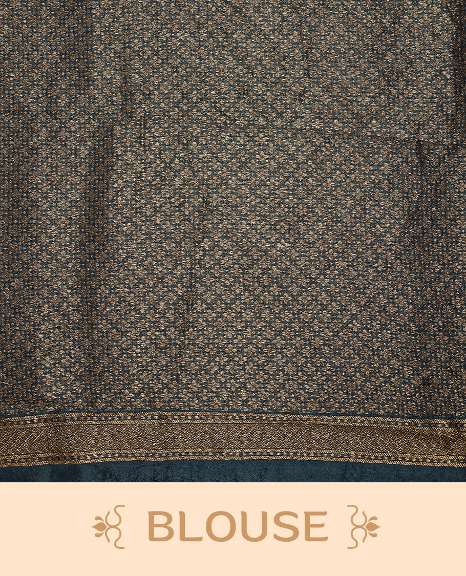 Deep teal colour Tussar Banaras saree adorned with delicate golden zari motifs on the body, rich floral woven zari border and grand pallu, paired with a matching blouse for an elegant and regal traditional look.