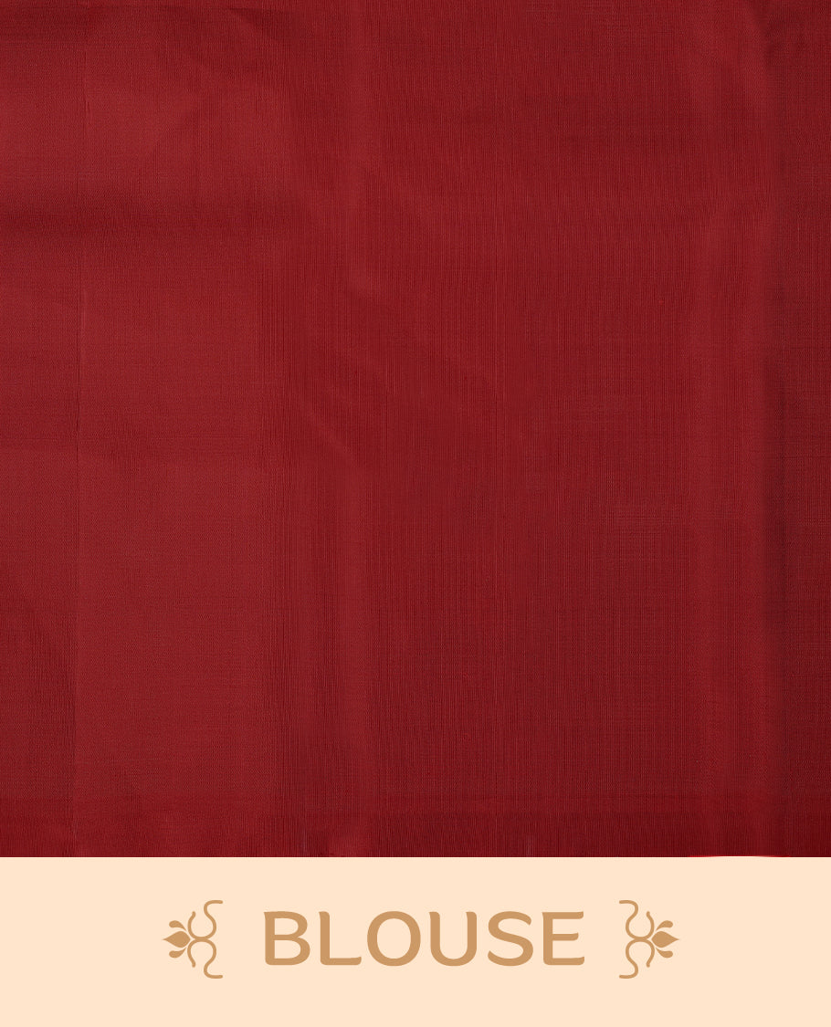 Deep red colour traditional Kancheepuram silk saree adorned with vertical rows of small golden motifs on the body, featuring a self-coloured simple border with floral chakra motifs, and paired with a matching blouse.