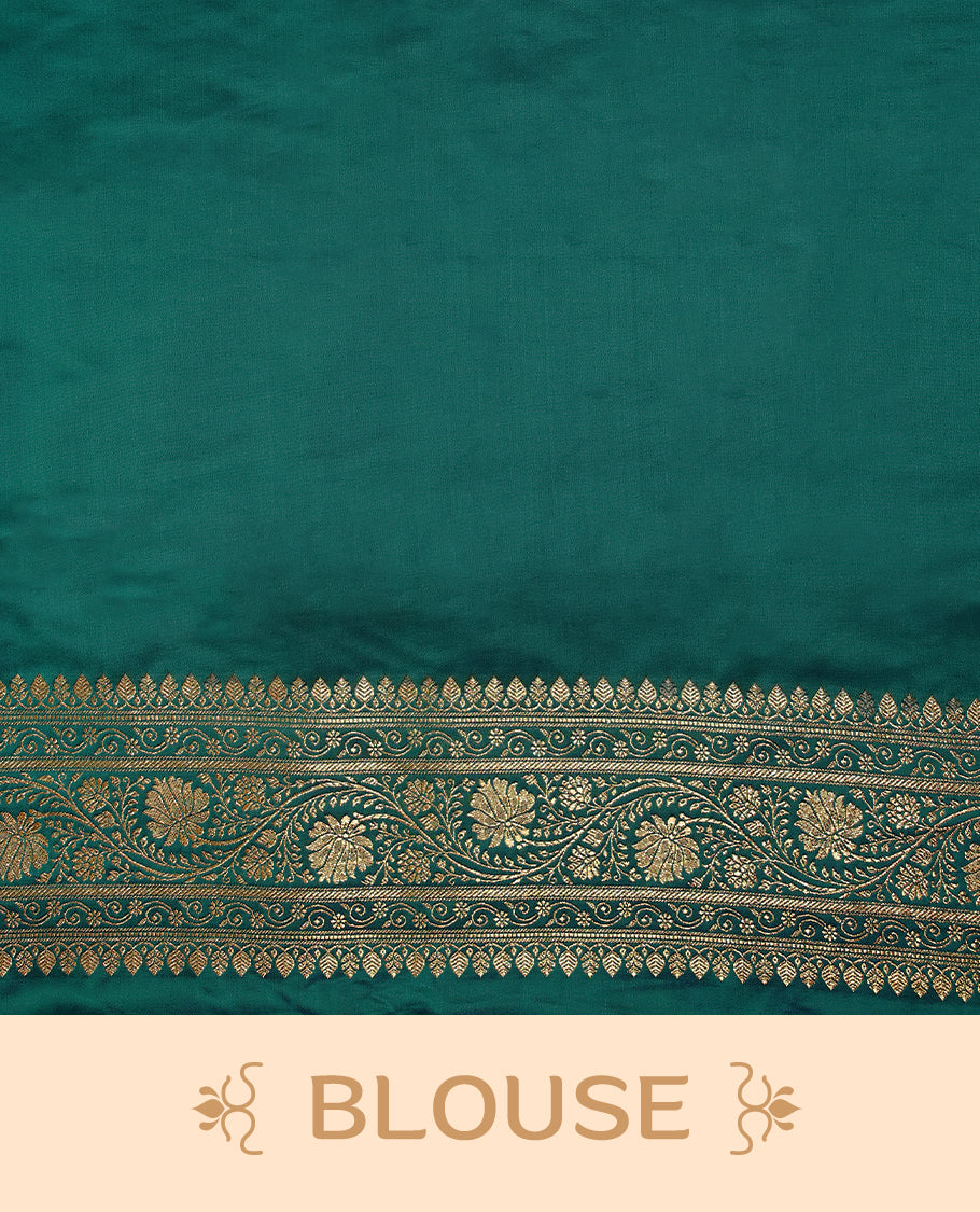 Deep sea green colour semi Banaras satin crepe saree featuring gold zari woven flower motifs across the body, complemented by an intricately designed traditional banarasi border and richly woven pallu, paired with a matching blouse piece.