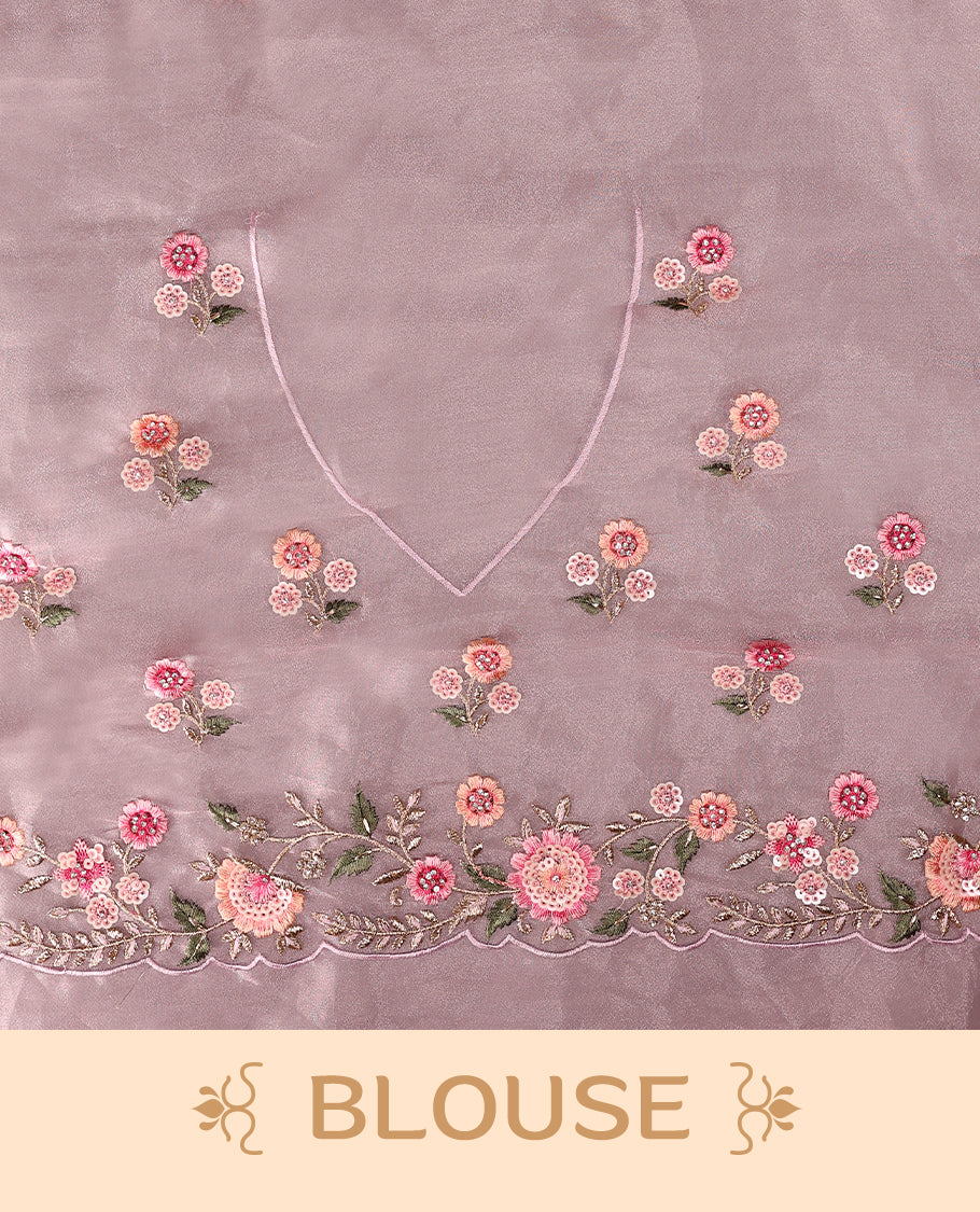 Pastel Pink Organza Tissue Silk Saree is beautifully adorned with intricate pink floral embroidery Border and a matching blouse.