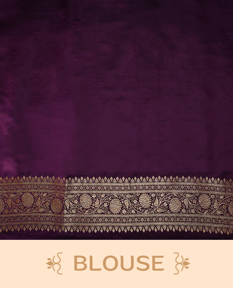 Grape wine colour semi Banaras satin crepe saree featuring gold zari woven small motifs across the body, complemented by an intricately designed traditional banarasi border and richly woven pallu, paired with a matching blouse piece.