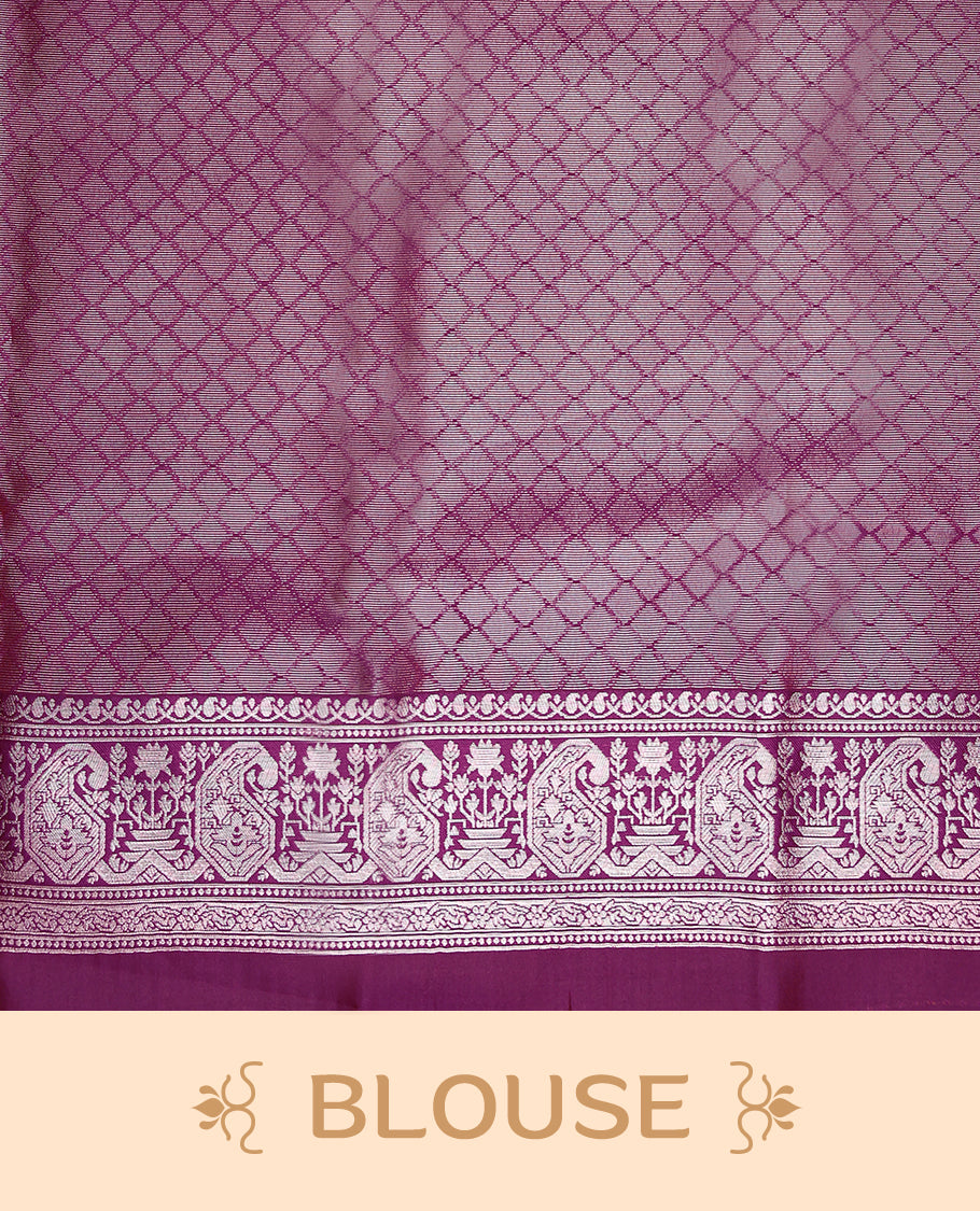 Pastel Peach coloured semi silk saree featuring a Silver coloured Zari design on the body, paired with a Grape coloured border and matching blouse.