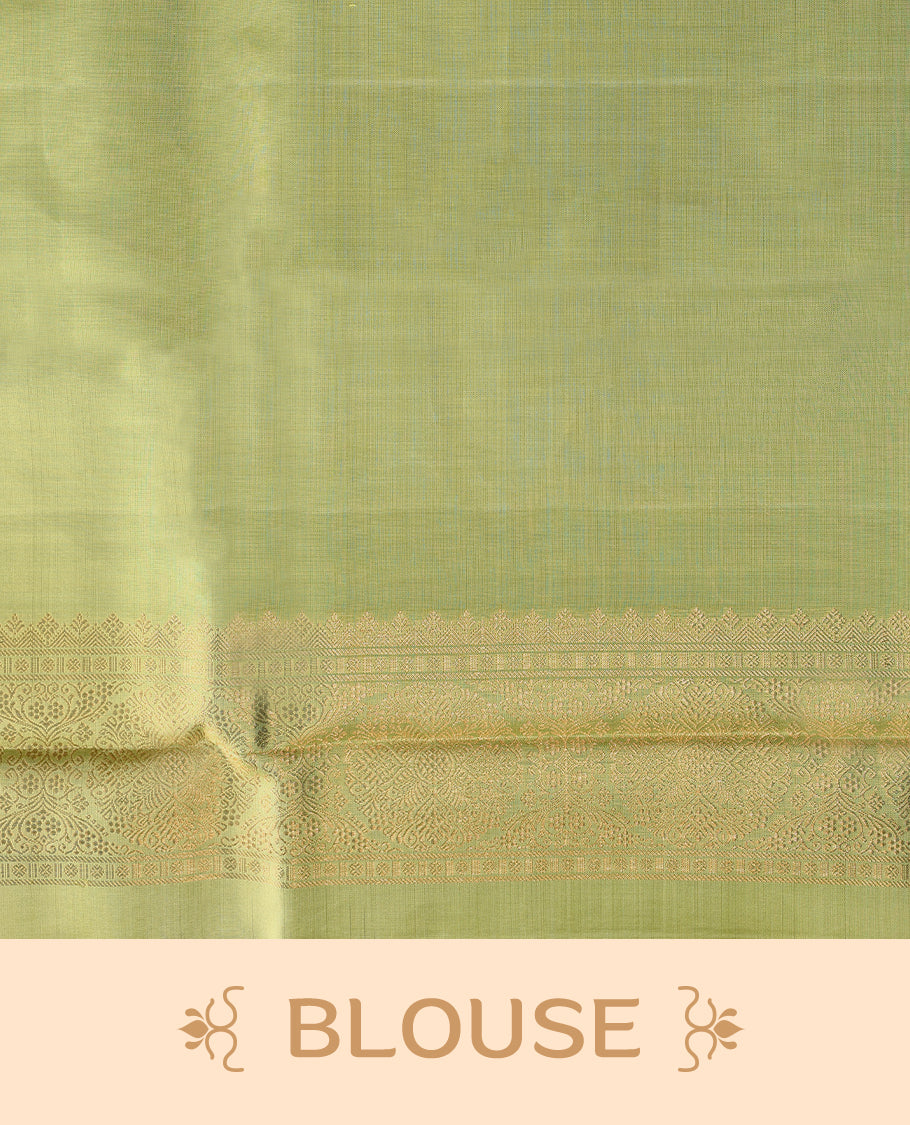 Solid black Colour traditional Kancheepuram silk saree adorned with antique zari motifs on the body, featuring a border with zigzag triangular patterns in alternating green and magenta over a coppery gold zari weave, and paired with a matching blouse.