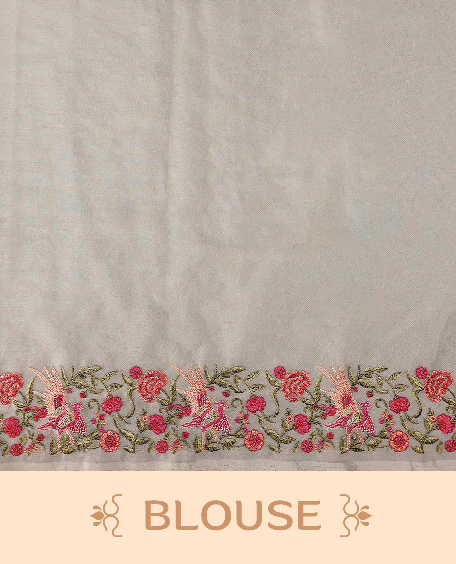 Off white colour organza saree featuring delicate floral and bird themed embroidery with scalloped edges on the border and pallu, lending a graceful charm. Paired with a matching blouse.