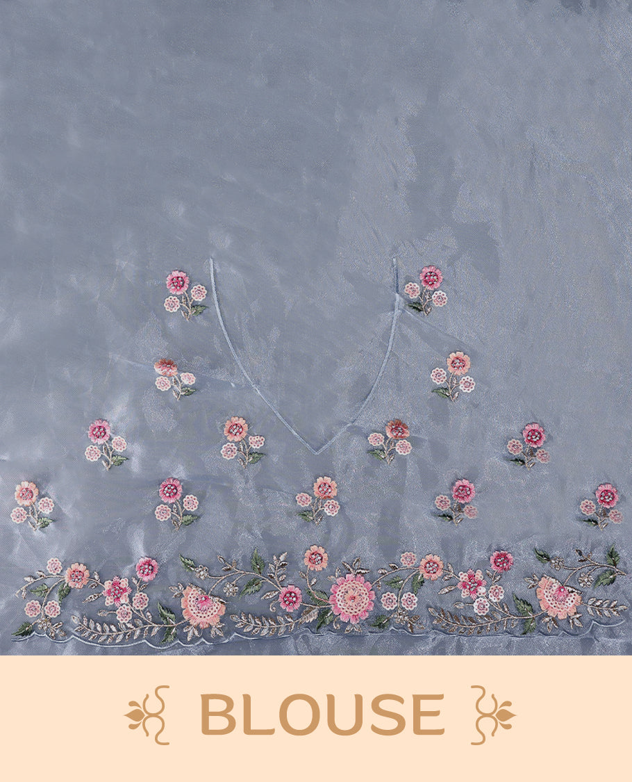 Powder Blue Organza Tissue Silk Saree is beautifully adorned with intricate pink floral embroidery Border and a matching blouse.