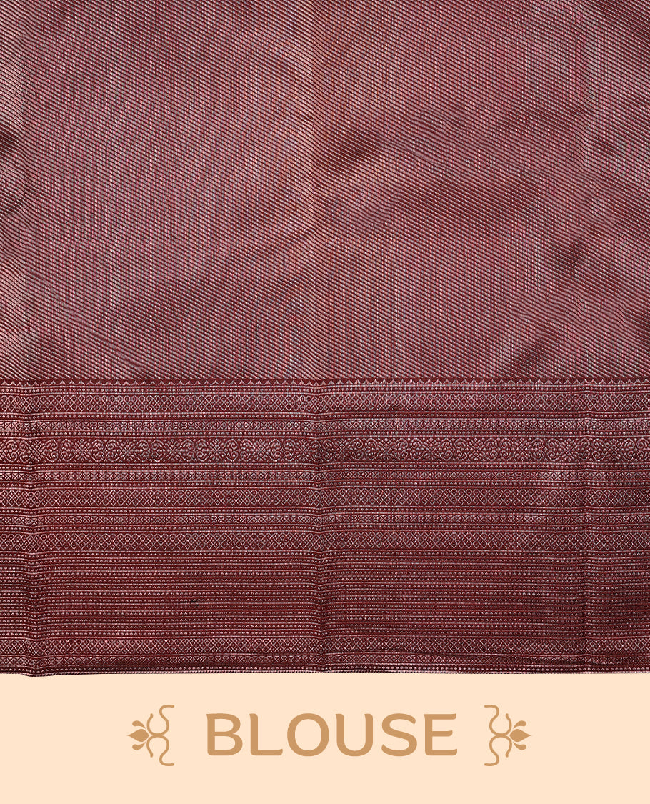 Maroon Colour Manthrakodi saree featuring an antique zari brocade body, complemented by a traditional Jada Naagam brocade border and a matching brocade blouse.