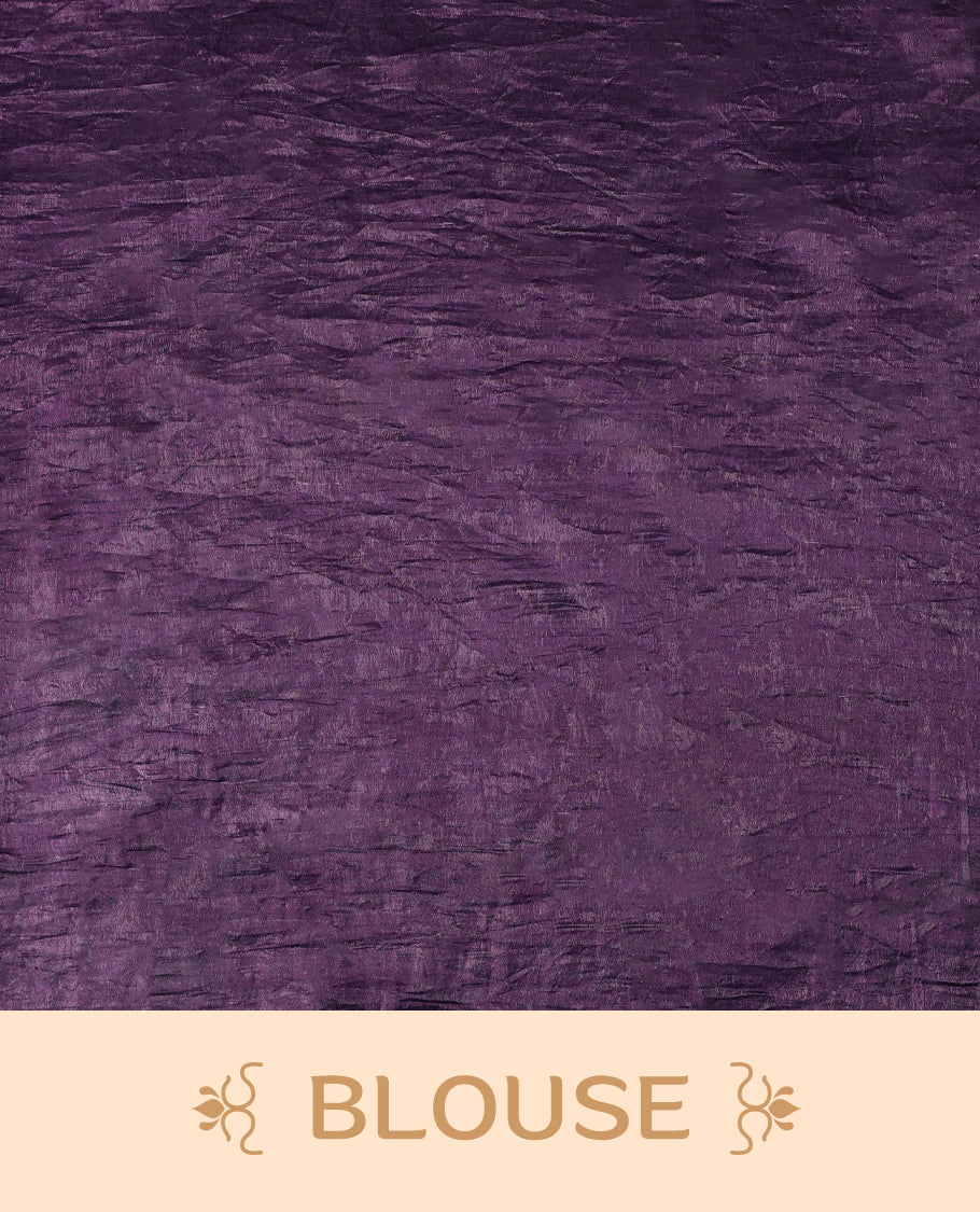Deep Grape Colour crush soft silk saree, textured body with a natural crinkled finish, adorned with intricate Silver colored Flower like Motifs and complemented by a delicate Silver Zari embroidery border, paired with a matching blouse