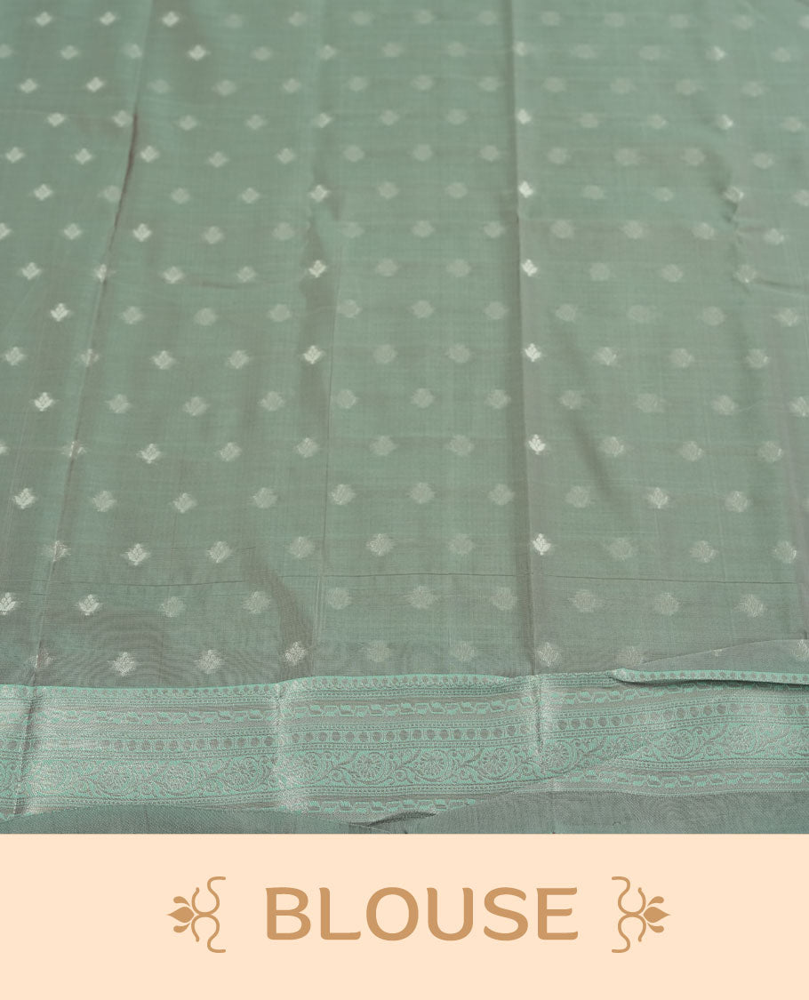 Pink colour semi silk saree adorned with subtle silver floral patterns on the body, complemented by contrasted a silver pallu intricately woven with rich floral patterns border and pallu, and paired with a matching blouse