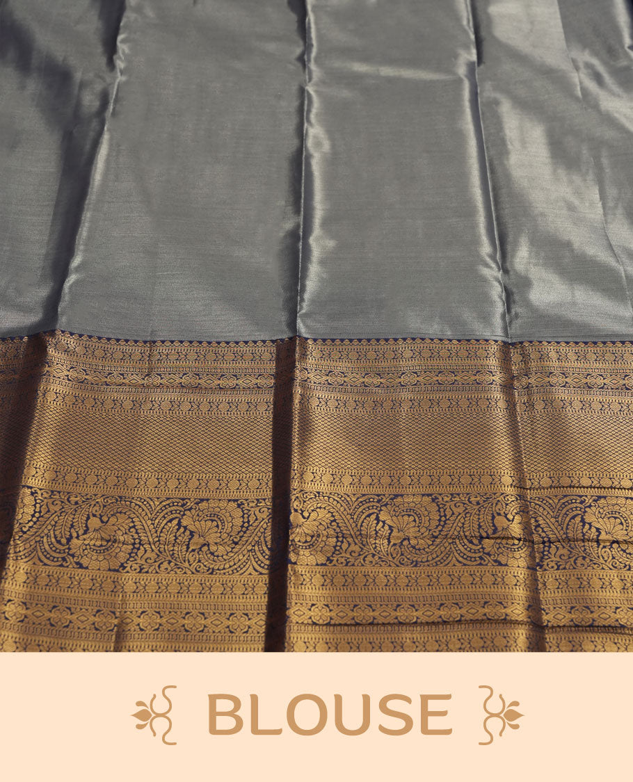 Aqua blue colour and Antique gold Zari Tissue Brocade Saree features intricate floral Motifs on body and navy blue colour border & pallu with traditional patterns paired with matching blouse