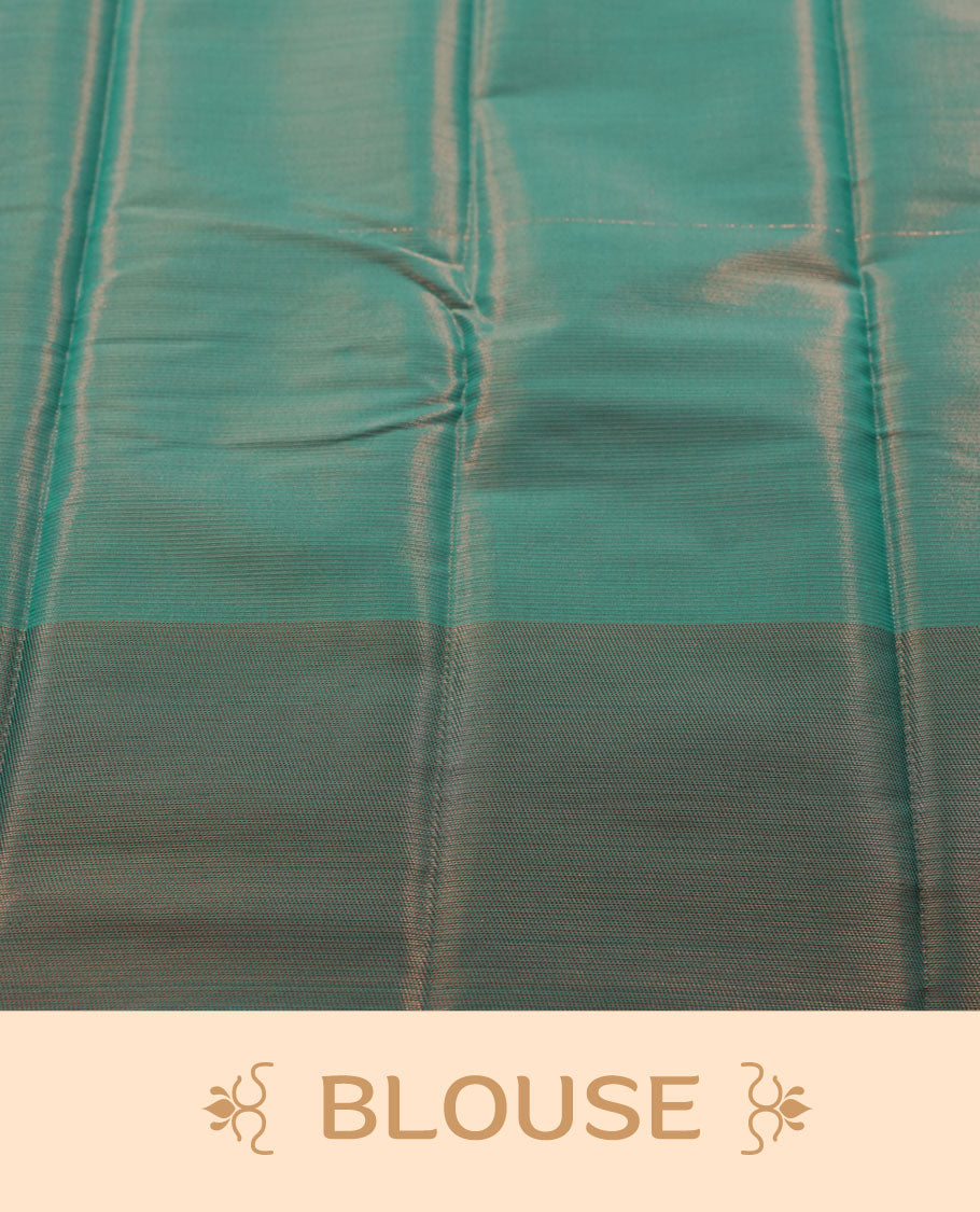 Deep purple colour semi silk saree featuring neem zari Brocade Pattern all over the body, complemented by a Self Colour woven border with detailing with contrast green Colour Pallu & blouse.