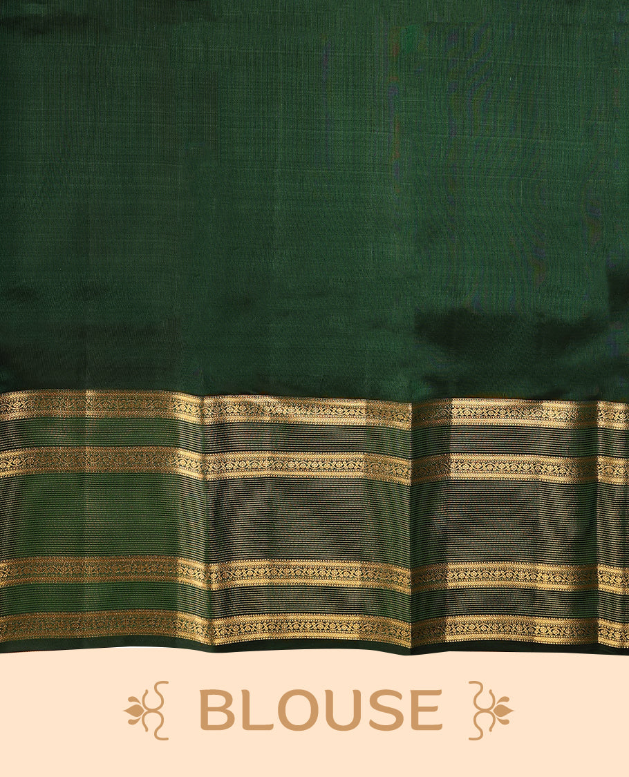 Bottle green Colour soft silk saree adorned with delicate golden zari flower motifs, featuring a stunning Neli Kamalam design border complemented by a plain blouse in a matching self-tone colour