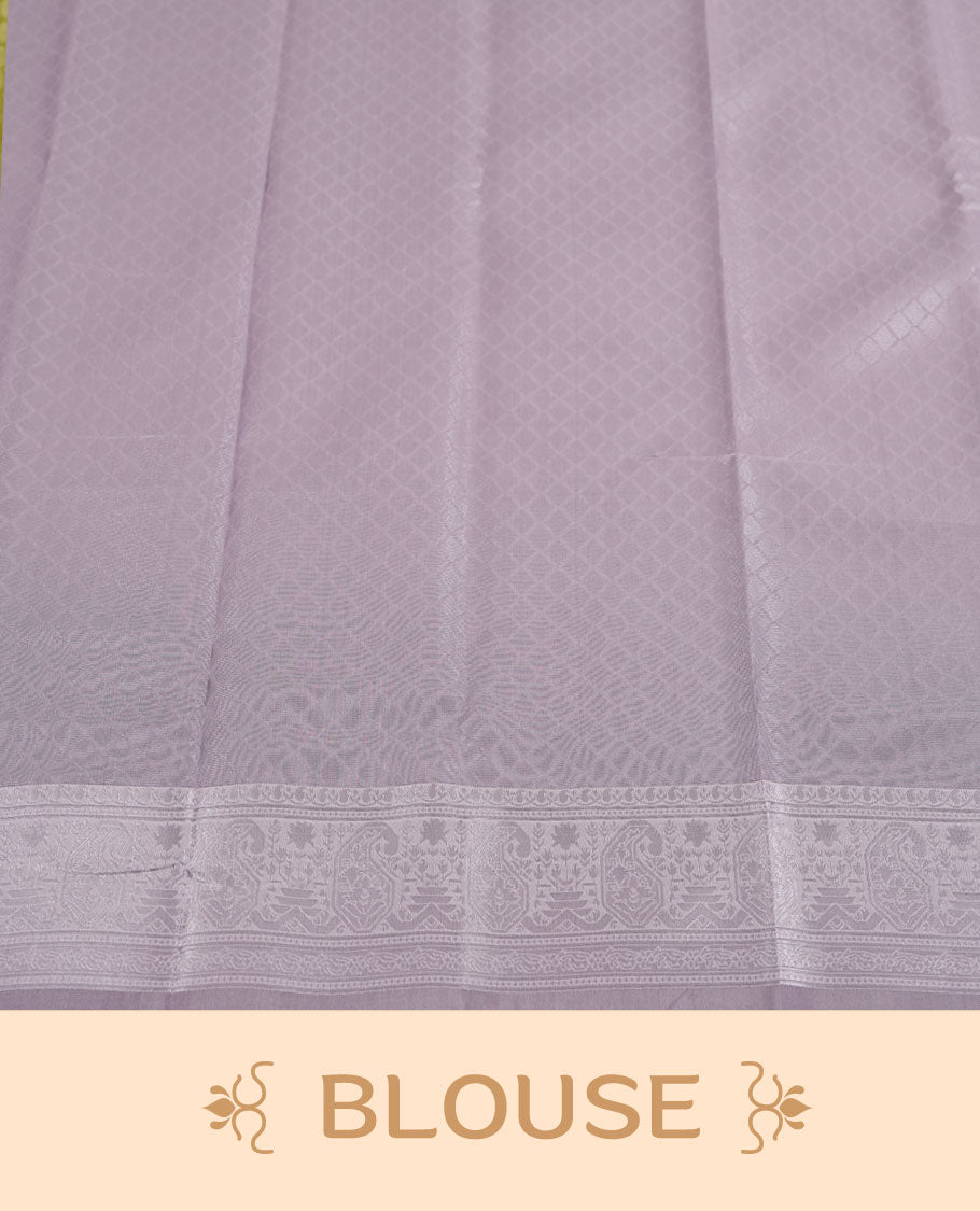 Light lavender colour semi silk saree adorned with subtle silver zari motifs on the body, complemented by a pastel light blue pallu intricately woven with rich floral patterns border and pallu, and paired with a matching blouse